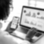 gh1325_A_Black_woman_using_her_laptop_and_smartphone_to_access__a5c8b494-7dff-4b1a-8324-8b