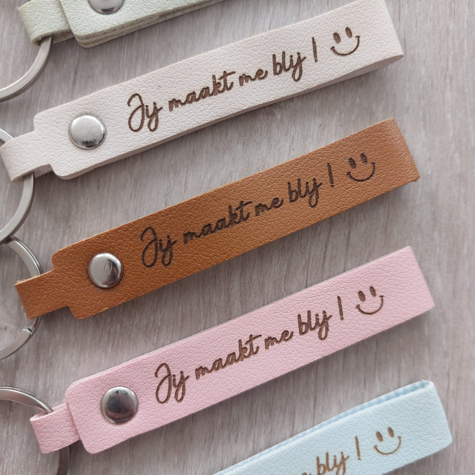 Lederen sleutelhanger met quote