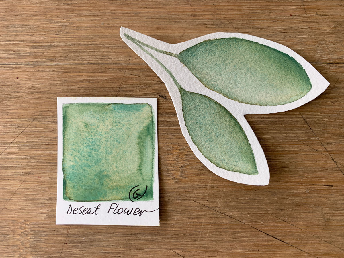 Elena Art Pages Artisan handmade watercolor paint of yellowy green watercolor called Desert Flower on a swatch card and leave painted cutout