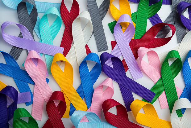 Multi colored cancer ribbon background. Proudly worn by patients, supporters and survivors