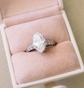 A marquise diamond engagement ring.