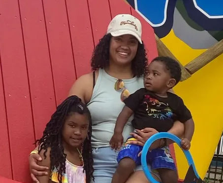 A mother with her 2 children