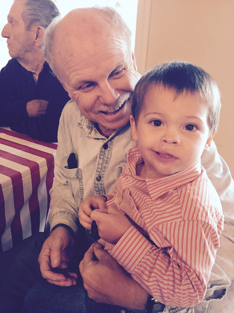 A grandfather with his grandson.