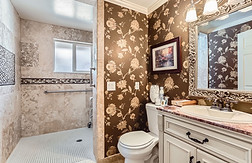 Professional caregiver providing medication assistance to a senior resident at Oswego Cottage adult care home in Lake Oswego, OR.