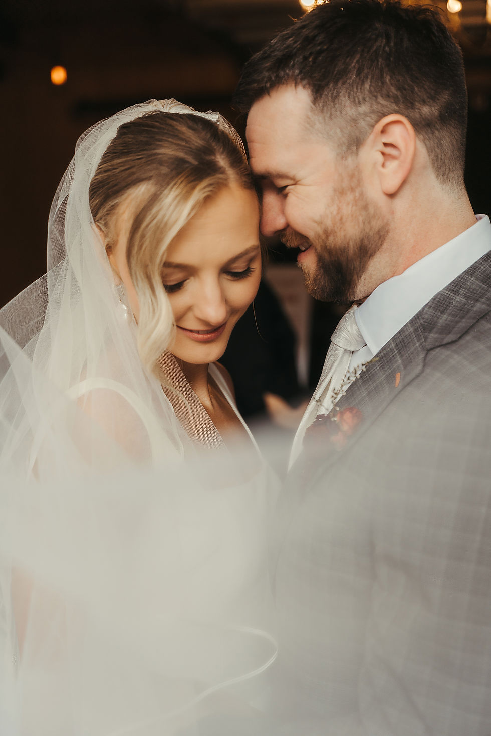 Bride and groom sharing an intimate first look outdoors at Rolling Ridge Wedding & Event Center