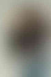 Couple hugging during relaxed anniversary couples photos indoors.