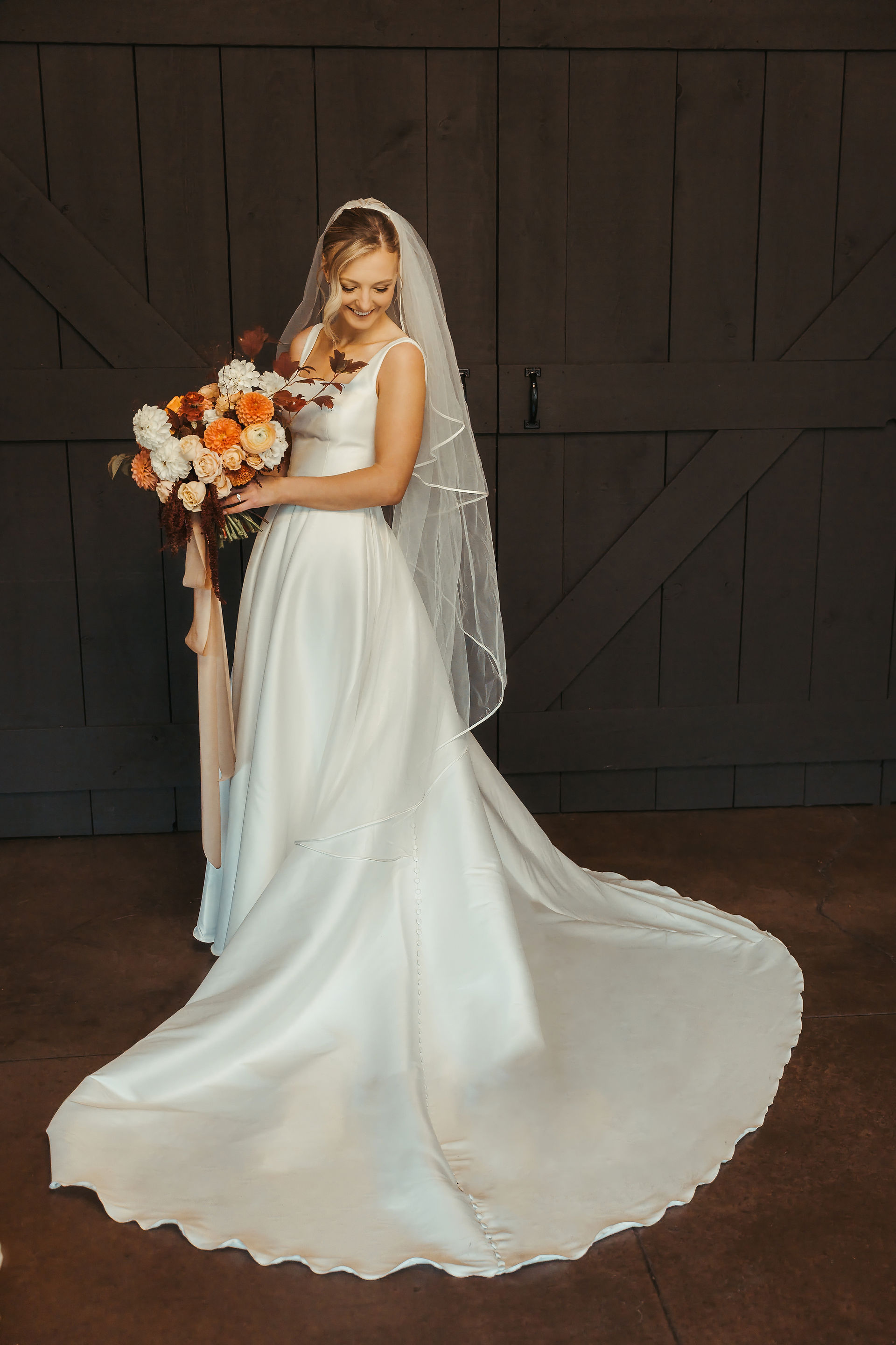Indoor bridal portrait with fall-inspired floral bouquet