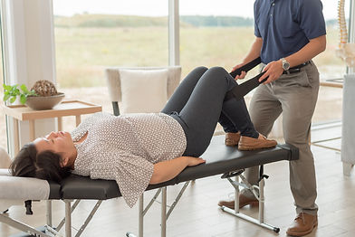 A London chiropractor treating a patient's lower extremity pain and discomfort.