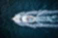 top-view-of-a-motorized-boat-sailing-through-water-2025-02-11-16-50-32-utc Medium.jpeg