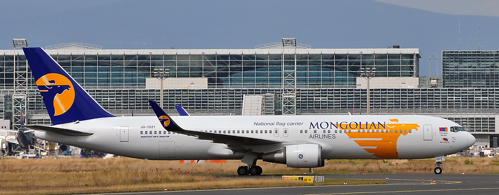 A MIAT Mongolian Airlines jet parked at the terminal of Chinggis Khaan International Airport