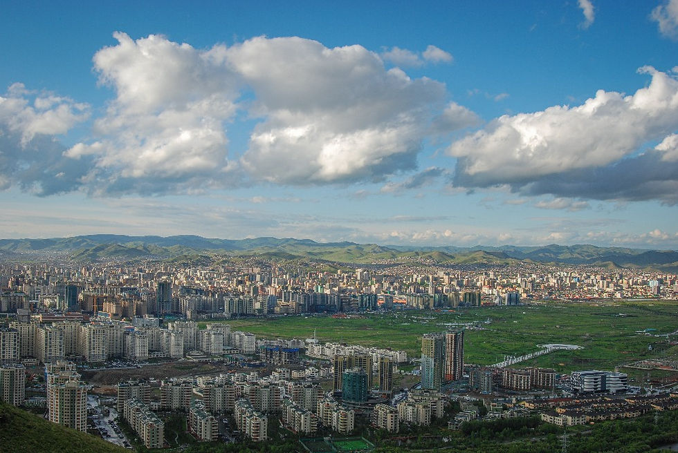 Ulaanbaatar city panorama from a hillside under clouds