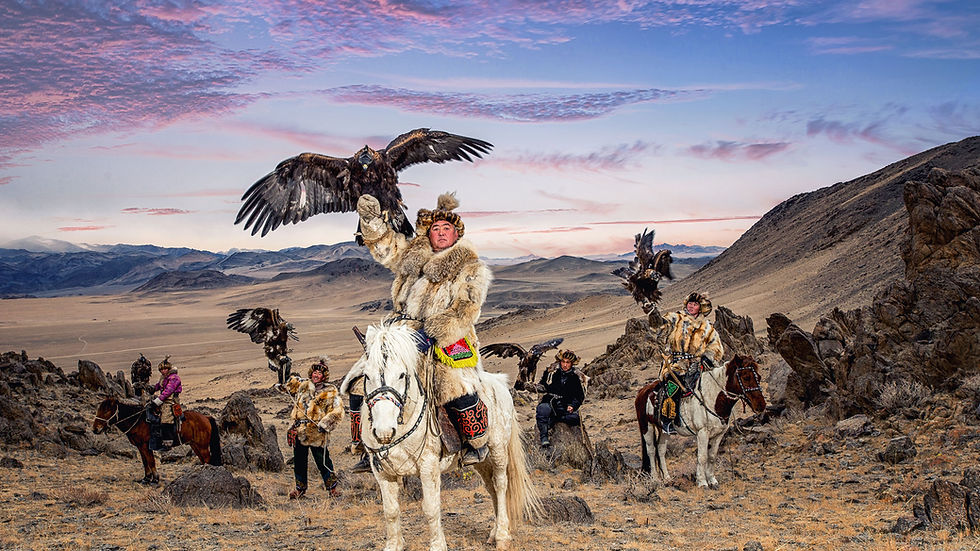 A traditional Kazakh eagle hunter on horseback in the Altai Mountains.