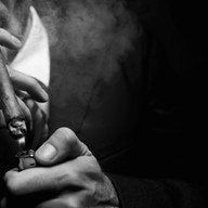 man smoking cigar