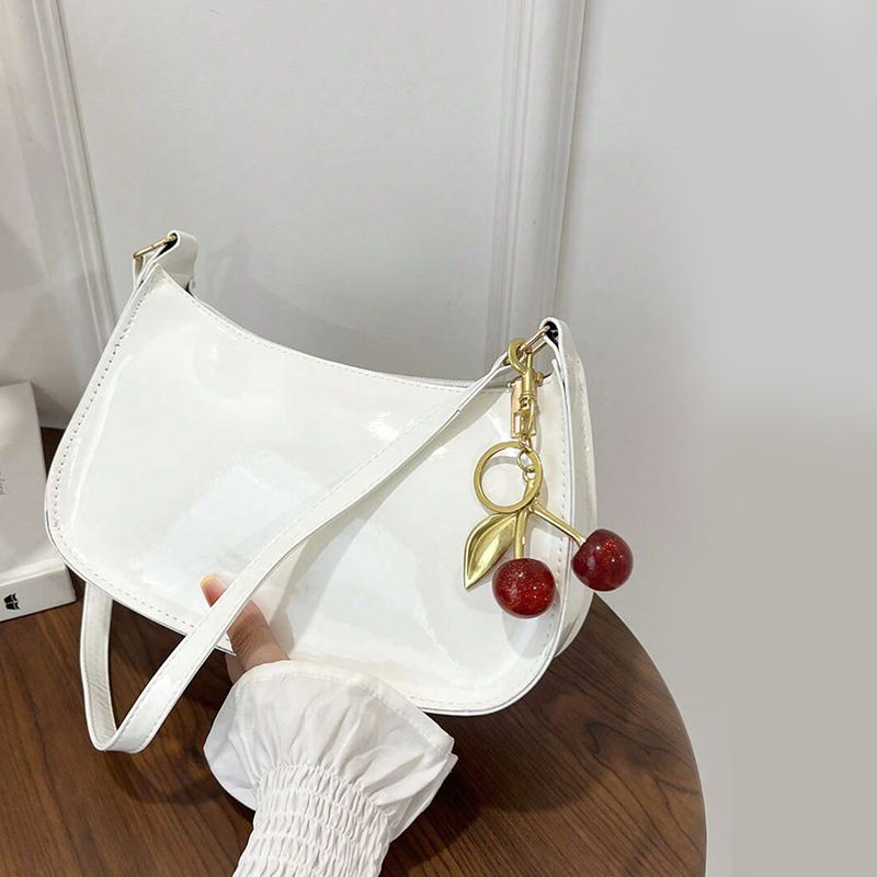 Thumbnail: The Soho Patent Curved Baguette Bag