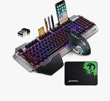Gaming Keyboard with multiple functions a mouse and a mouse pad and with lights behind the keys.