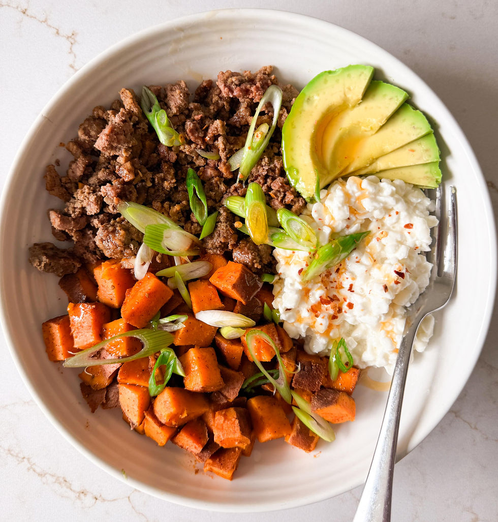 Nourishing bowl with ground beef, roasted sweet potatoes, avocado, and cottage cheese.