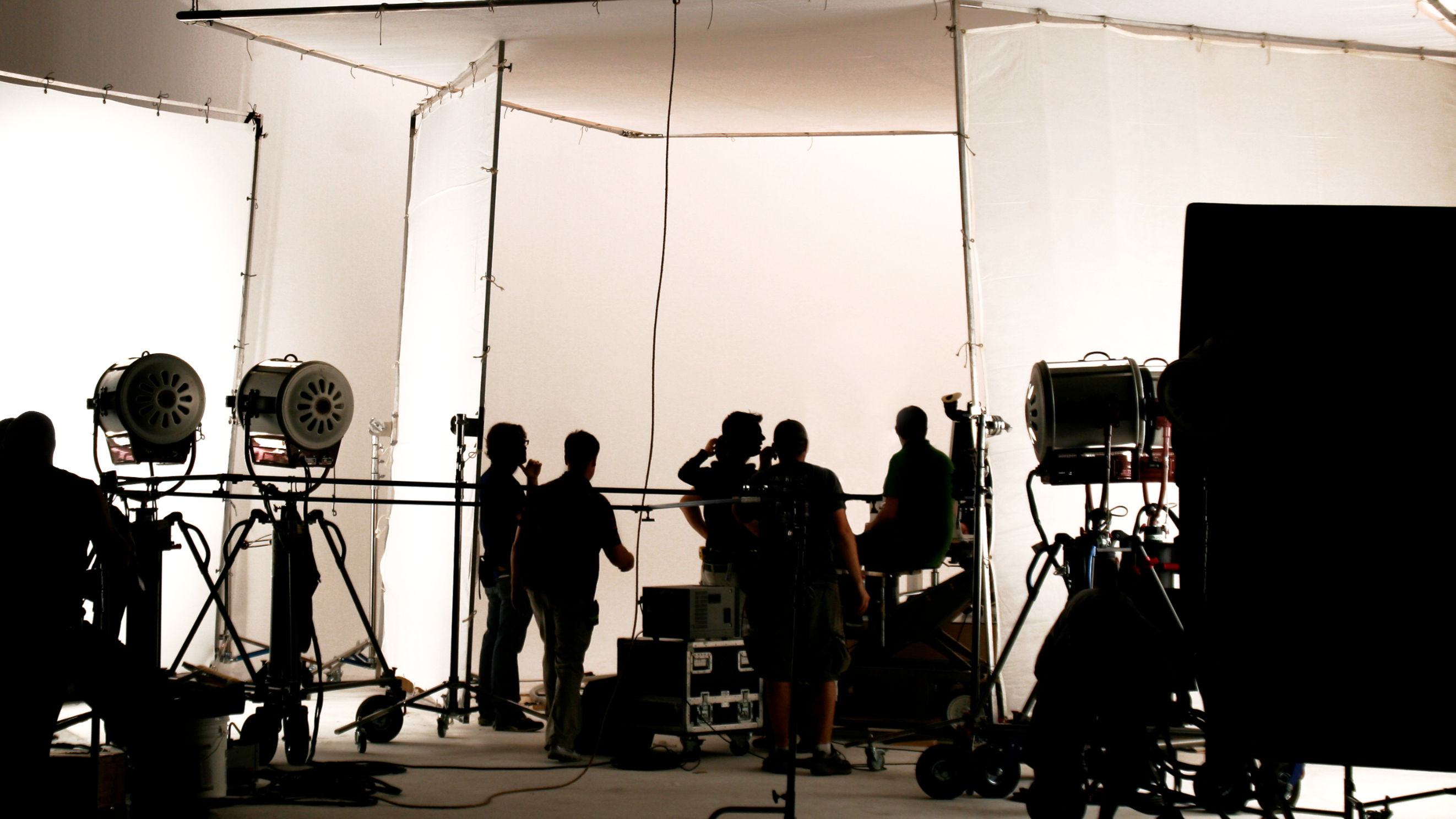 A black and white crew on set photo.