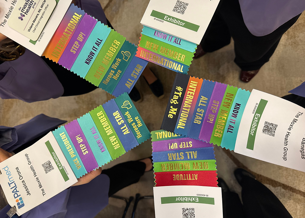 People holding colorful conference badges with ribbons labeled "INTERNATIONAL", "ALL STAR", and more. Badges display "Exhibitor" and QR codes.
