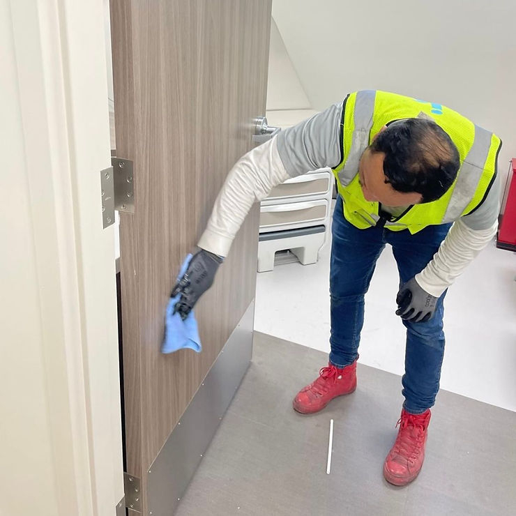 cleaner wipes down door
