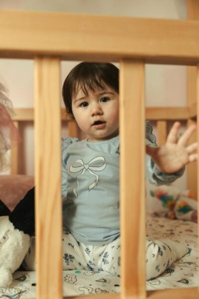 Toddler in Crib | The Peaceful Sleeper
