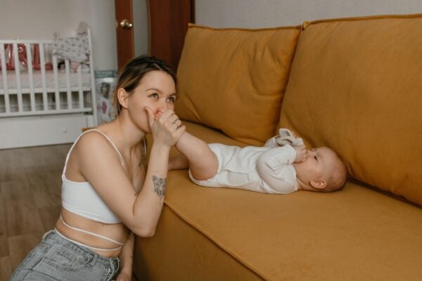 Mom and Baby on Couch | The Peaceful Sleeper