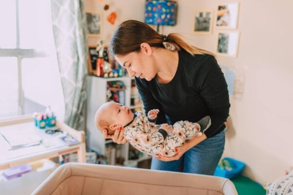 Mom Holding Newborn Baby | The Peaceful Sleeper