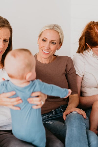 Moms Smiling at Baby | The Peaceful Sleeper
