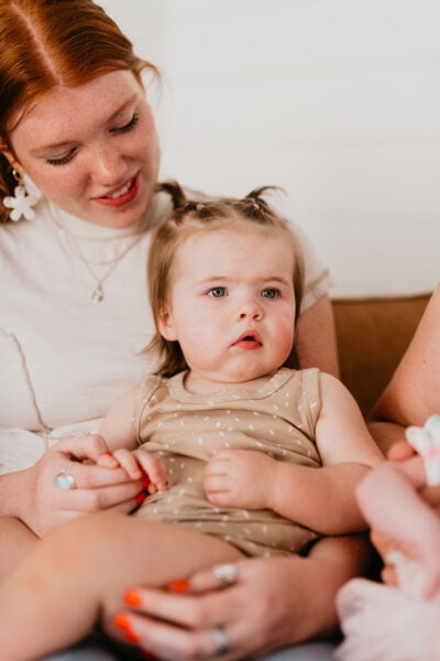 Mom Holding Baby | The Peaceful Sleeper