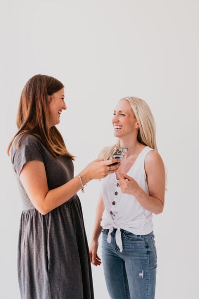 a mom laughing while working with a sleep consultant | The Peaceful Sleeper