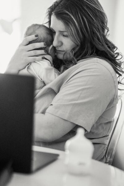 Mom Holding Baby - Sleep And Postpartum Well-Being | The Peaceful Sleeper