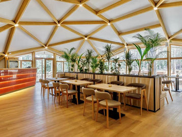 Geodesic dome restaurant with immersive dining atmosphere and panoramic views.