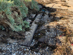 Remains of Long Beach boat ramp exposed by recent high seas