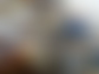 Retired commercial photographer Ted Richards, holds his 1st and 1000th artefacts