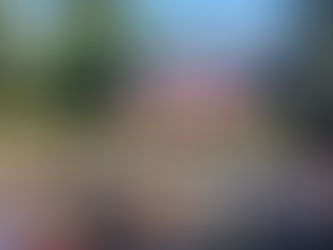 A large audiance at a outdoor cinema watching the Wicked movie