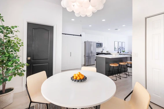 A modern dining room and kitchen in a condo downtown Delray Beach
