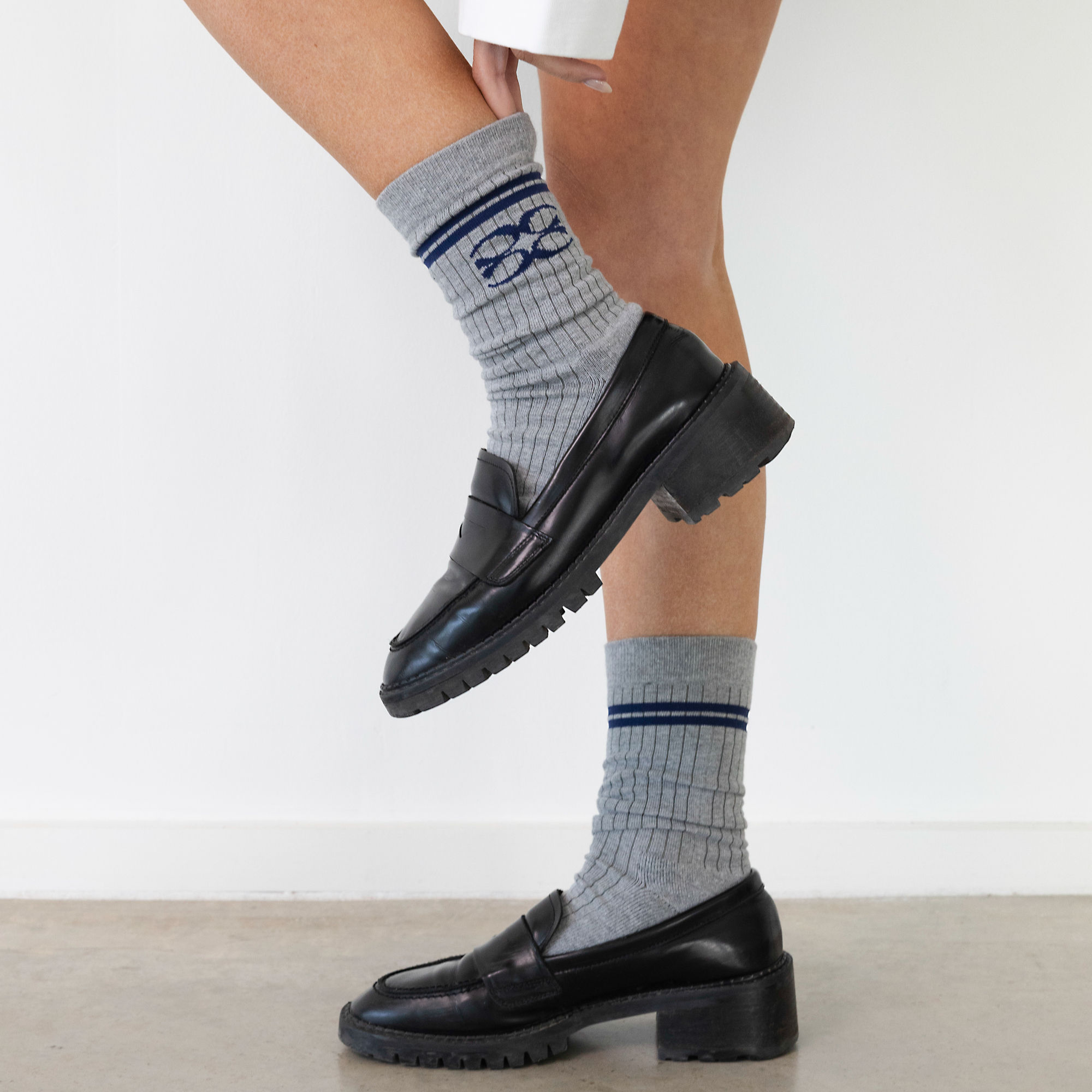 COUCOU Coucou Socks grey with navy logo.