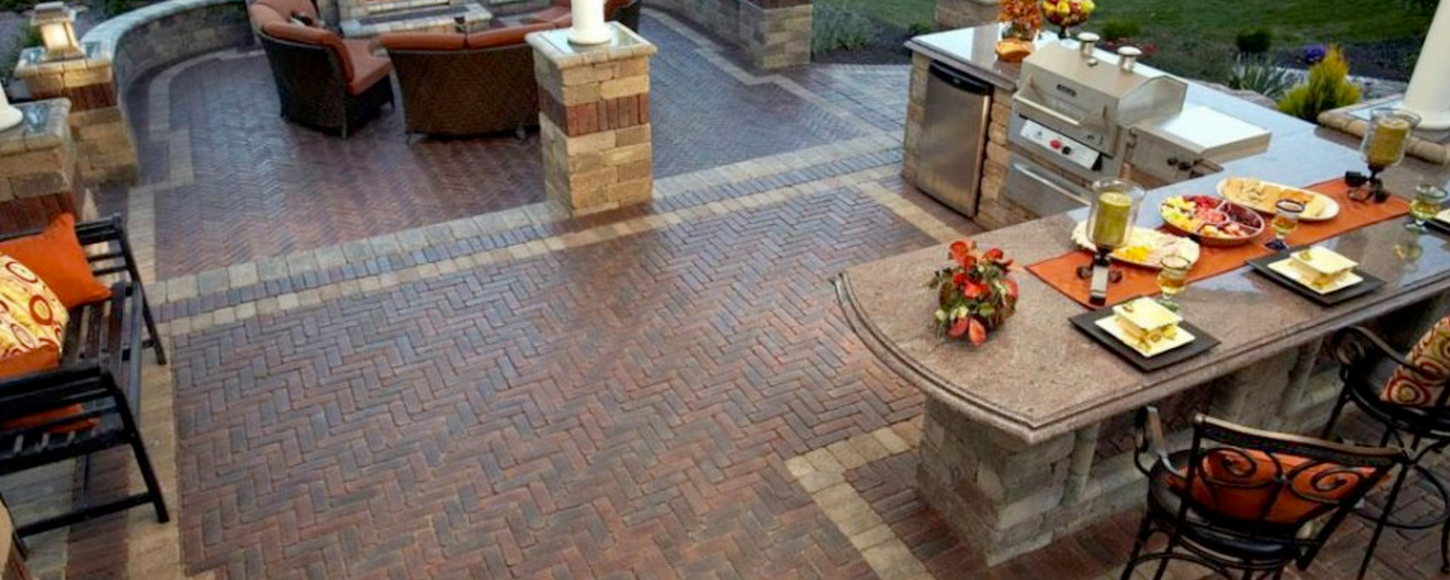 Enjoy outdoor gatherings on a well-crafted patio featuring expertly installed brick pavers.