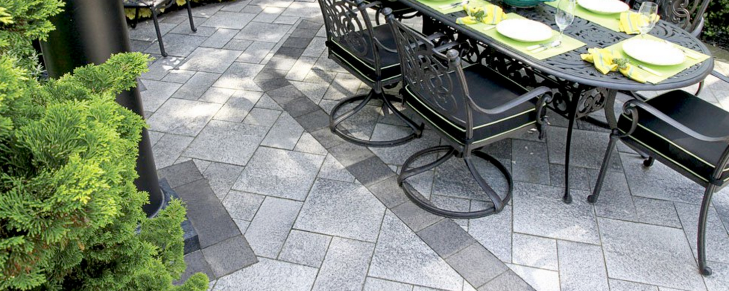 Beautiful patio brick paver installation with intricate pattern and vibrant colors.