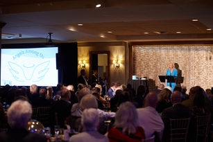 Dr. Tracey Skale Presents the "Angels Among Us" Award at Champions of Hope 2023