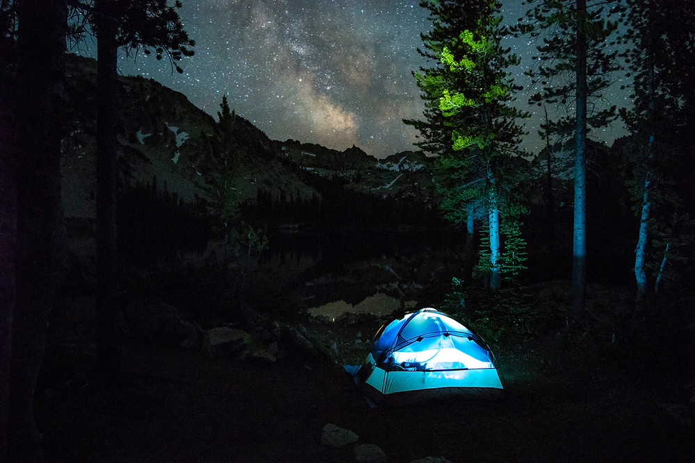 My tent illuminated beneath the Milky Way at Alice Lake