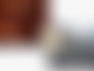 Side-by-side comparison of copper and aluminum metal pipes with a 'VS' graphic in the center, symbolizing the durability debate between copper vs aluminum gutters in Texas.