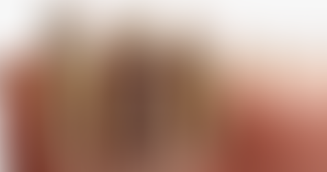 Close-up of dental implant and natural teeth in a jaw model. Implant shows metal screw; teeth are white with pink gums, illustrating dentistry.