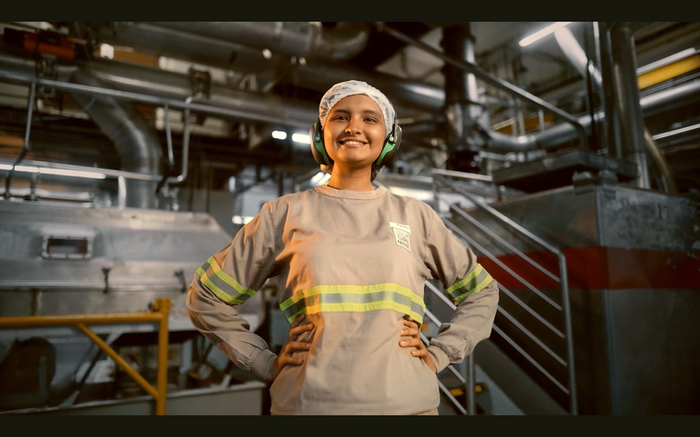 Spray-drying specialist working inside a coffee processing facility in São Paulo