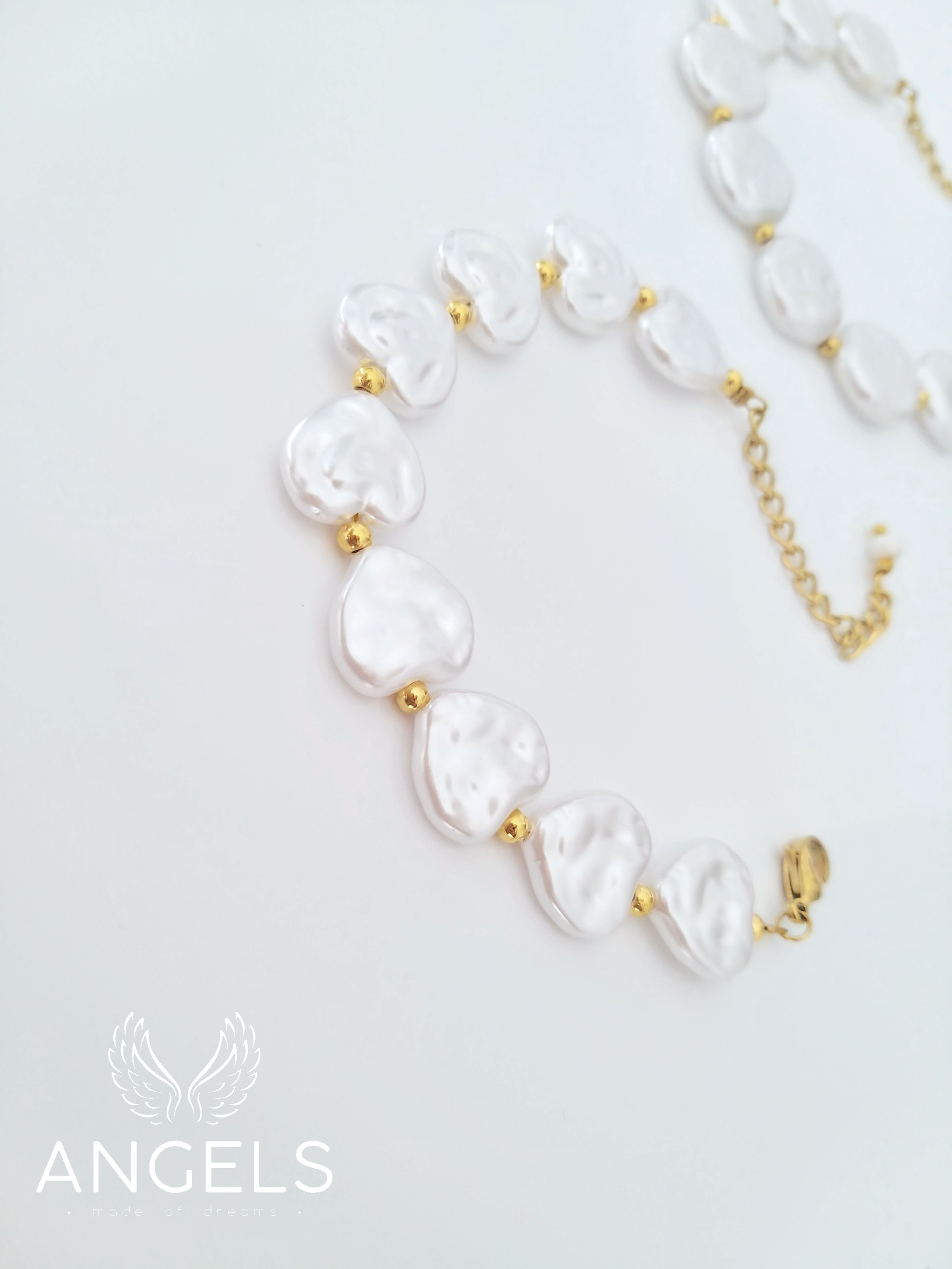 Ατσάλινο βραχιόλι με πέρλες.