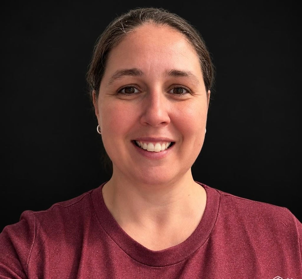 Smiling portrait of a female certified trainer.