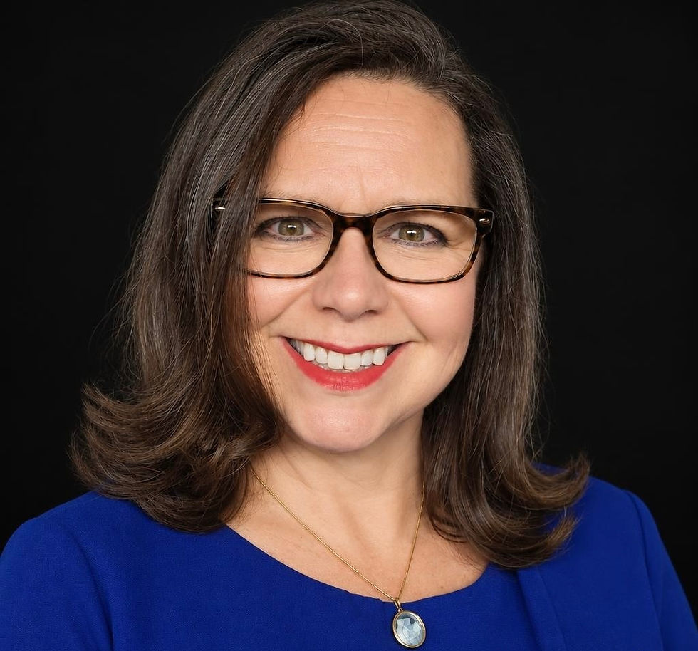 Certified trainer smiling in a blue top and glasses