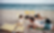 dad and kids at the beach
