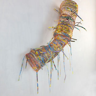 colorful woven paper cylinder wall sculpture  in a curve shape