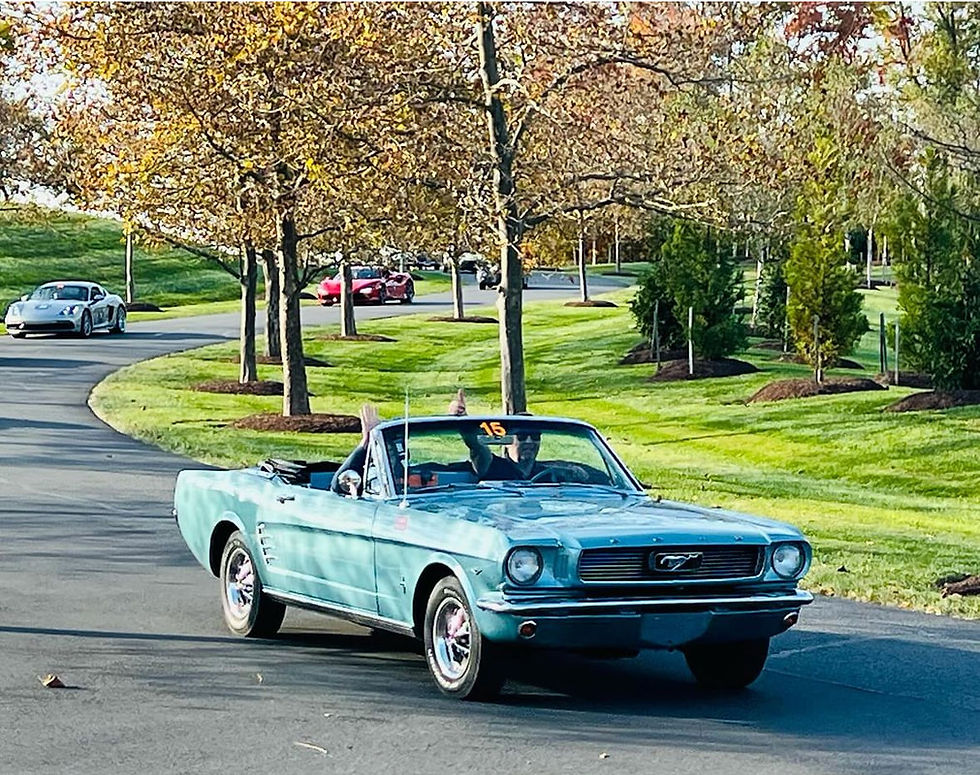 At the wheel of the 1966 Ford Mustang Convertible in the grounds of Salamander Middleburg