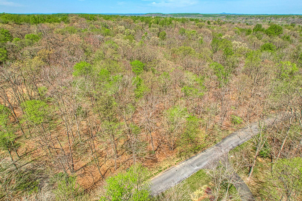 The 5 acre land lot, on private paved Edmonston Drive, has received perc approval for a 6-bedroom home